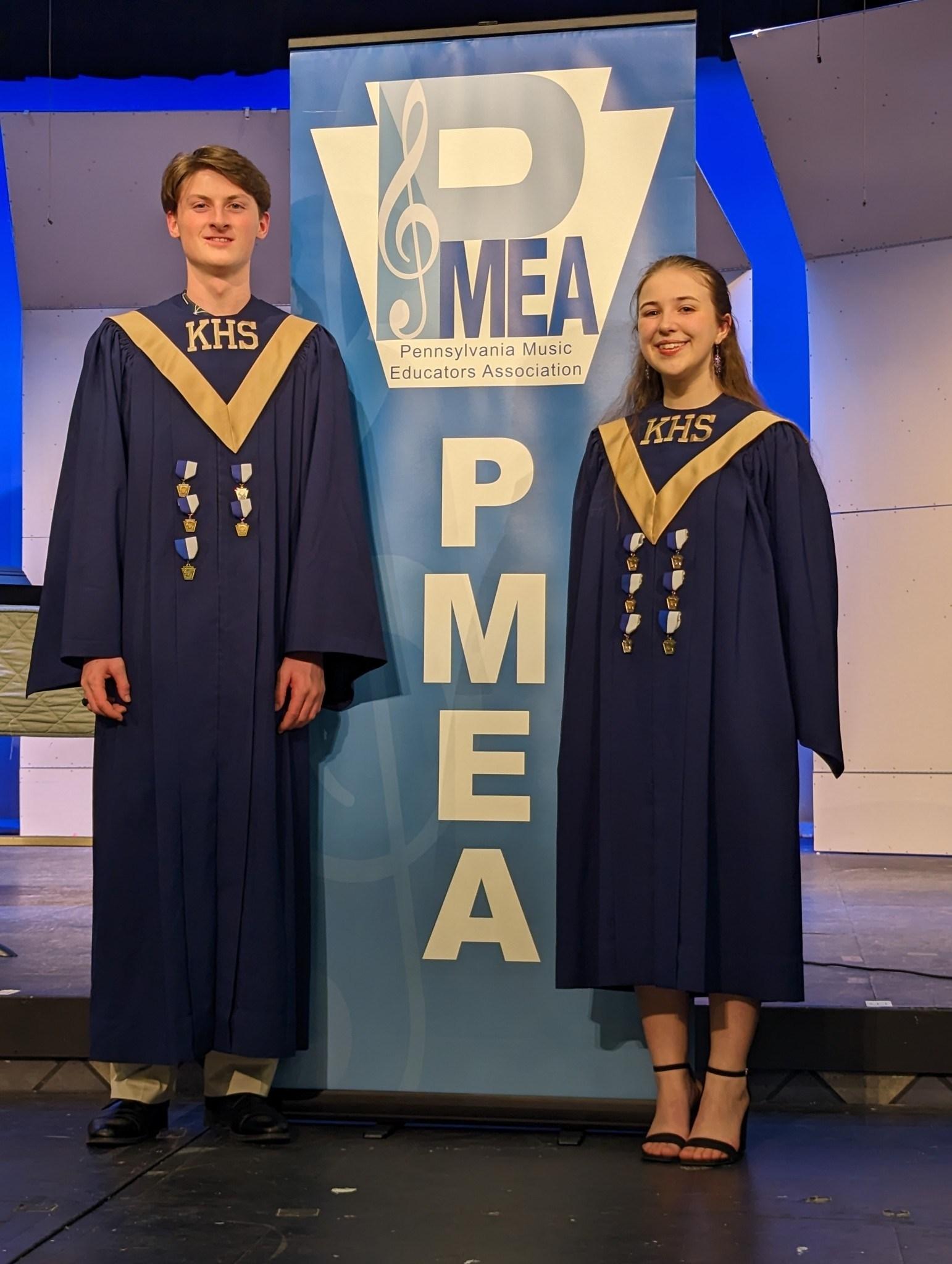 pic of two students wearing choir robes